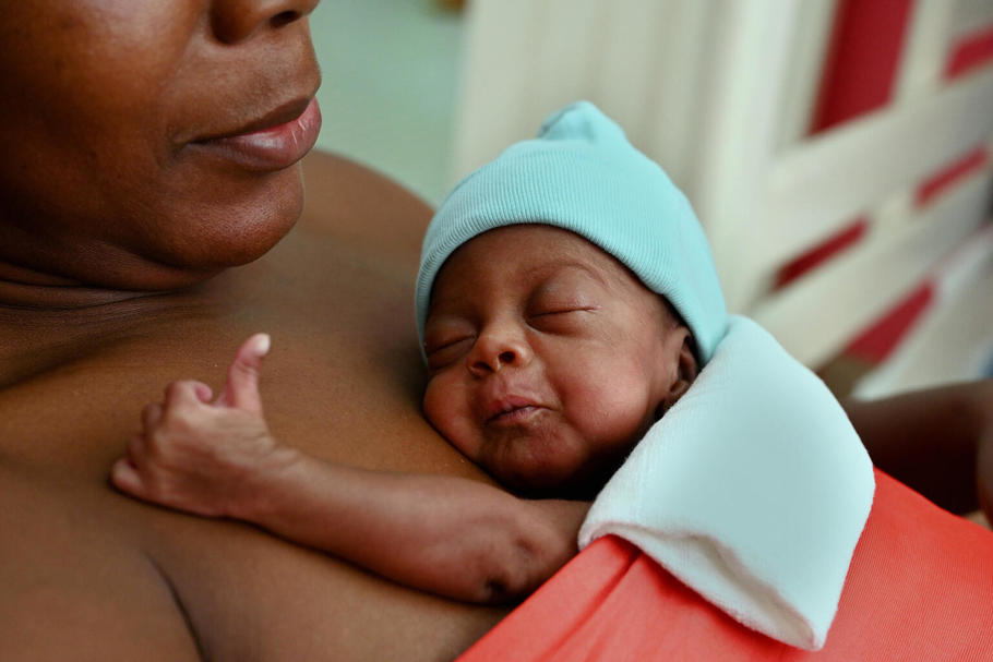 Women with baby on her chest 