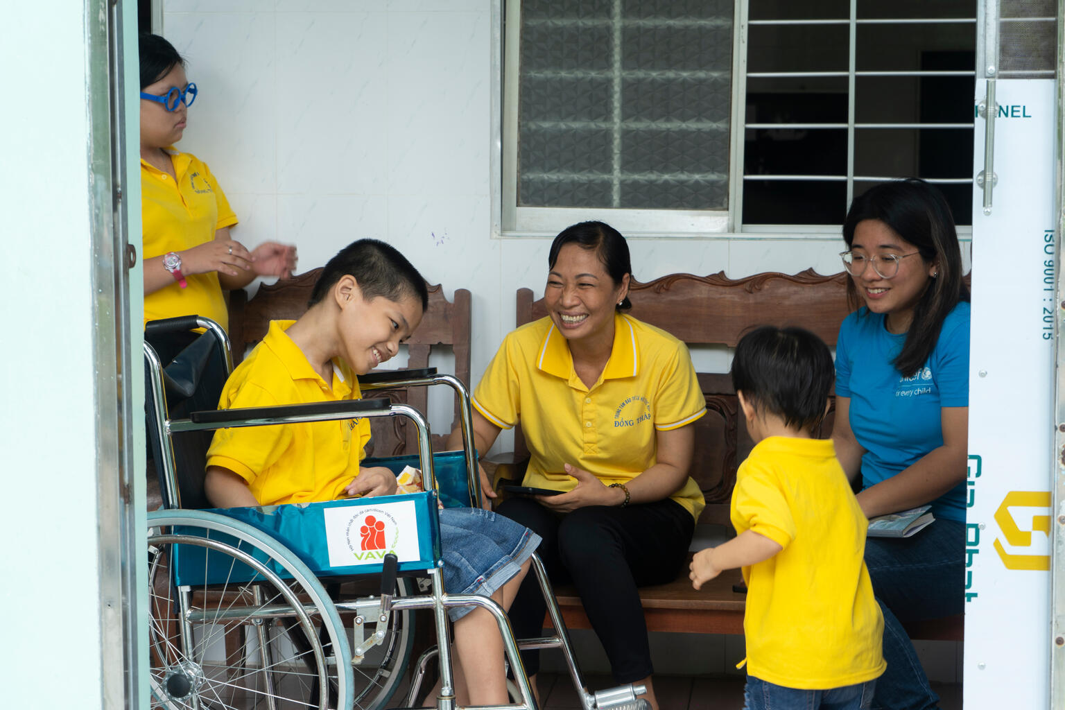 Boy in a wheelchair smiling